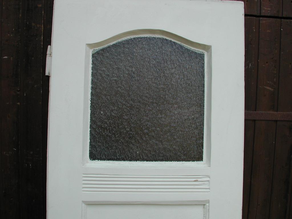 Historische Zimmertüre mit original Verglasung und geschwungenem Fries